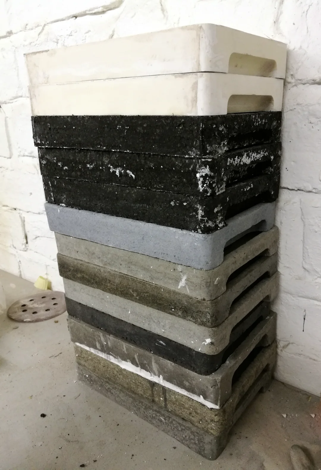 Stacked prototype versions of the dram tray, including foam positives